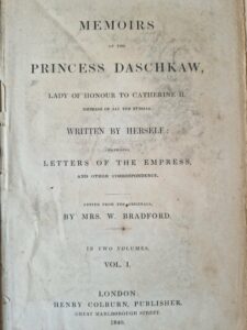 Image of a book's title page. The page is made from paper is yellow and discoloured. At the top in bold black font it says Memoirs of Princess Daschkaw.